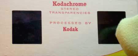 Using a very soft cloth to clean a 3D stereo slide